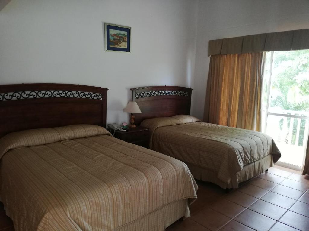 Postel nebo postele na pokoji v ubytování Villa Angela