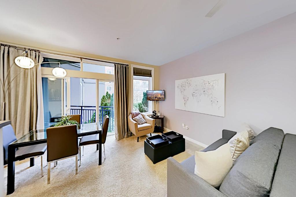 a living room with a couch and a dining room at Belltown Court III in Seattle