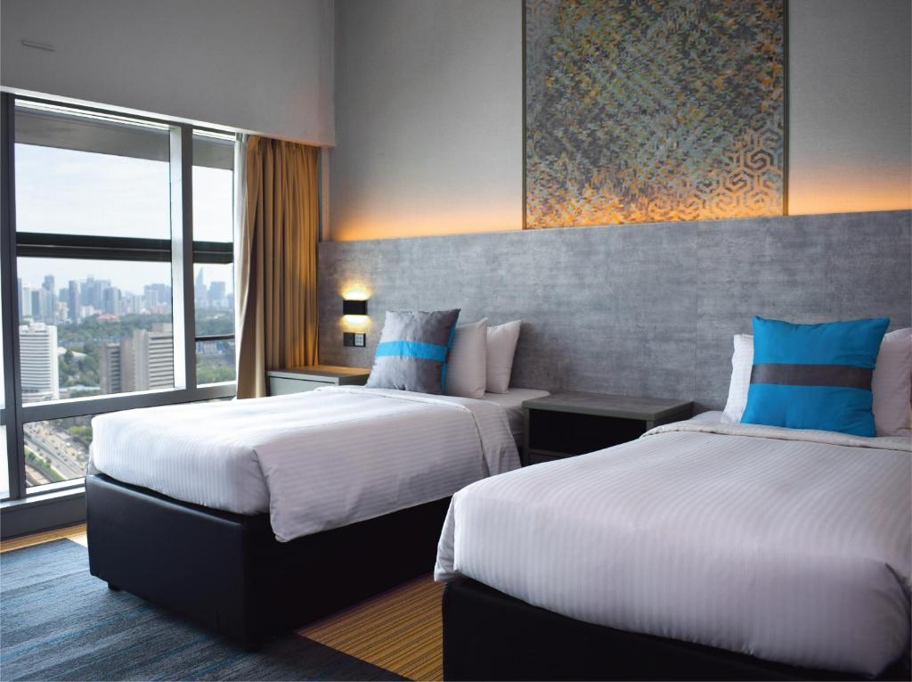 Кровать или кровати в номере Premiera Hotel Kuala Lumpur