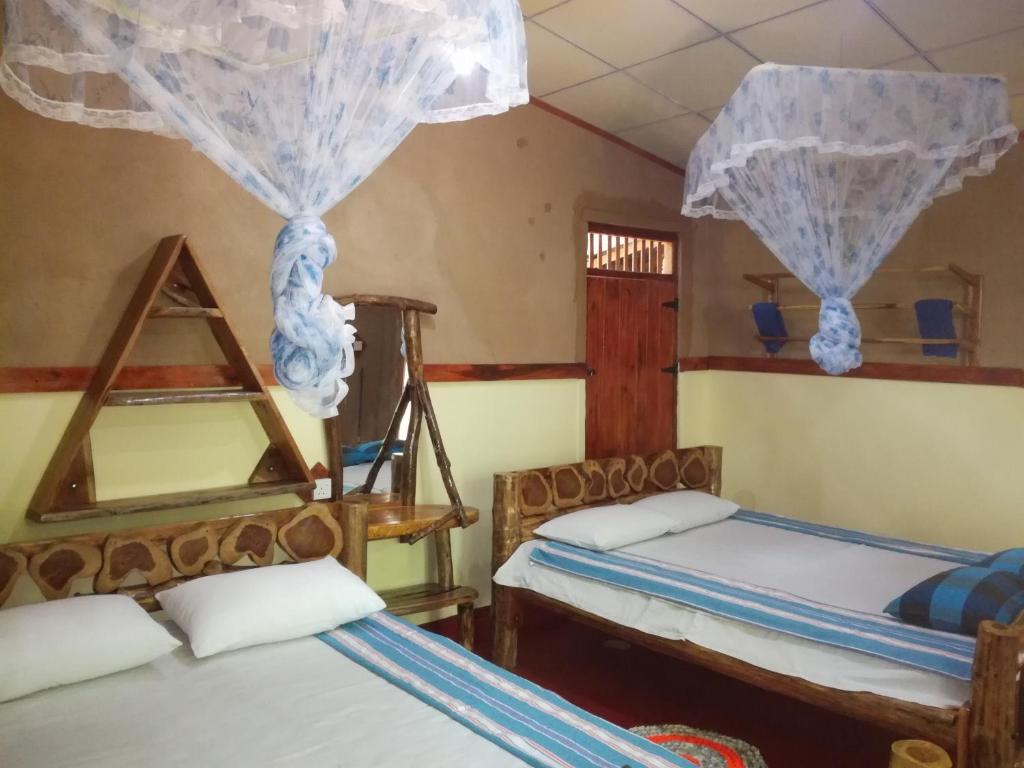 Postel nebo postele na pokoji v ubytování Sigiriya Freedom Lodge