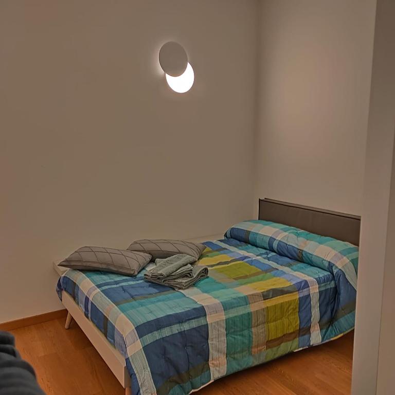 A bed or beds in a room at B&B Markone Bologna Center