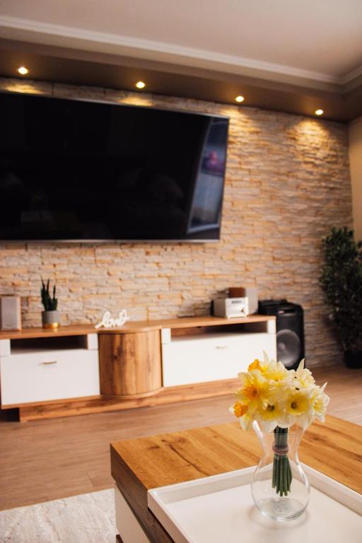 Televízia a/alebo spoločenská miestnosť v ubytovaní Villa Valf