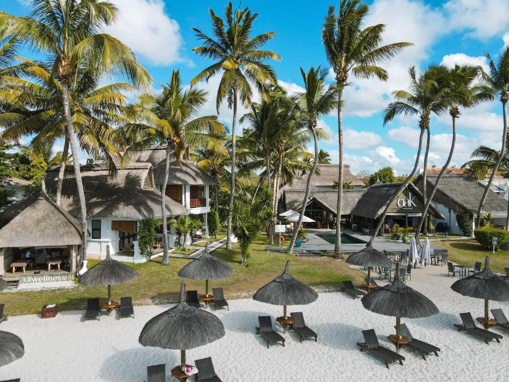an aerial view of the resort with chairs and umbrellas at Constance Sakoa Boutik in Trou aux Biches