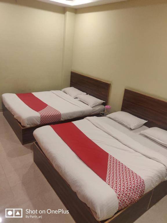 Postel nebo postele na pokoji v ubytování Sukrangu Palace