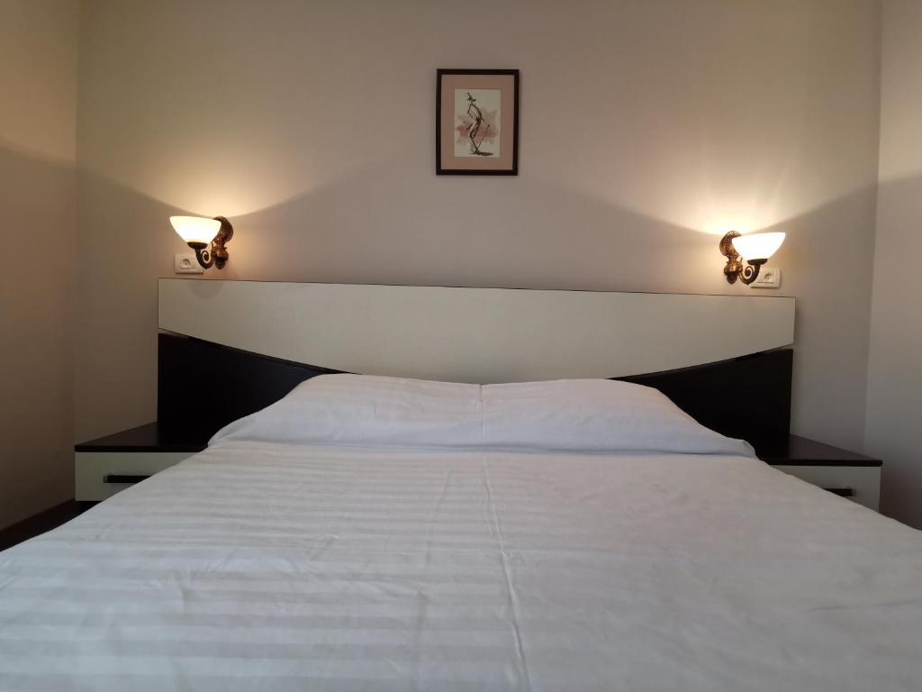 Postel nebo postele na pokoji v ubytování Hotel New Derby