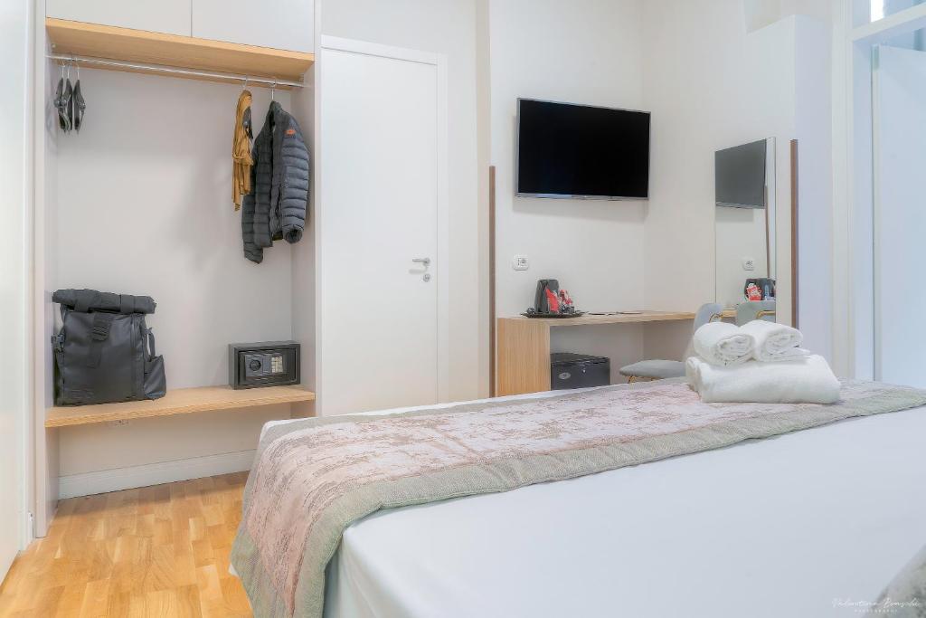 Postel nebo postele na pokoji v ubytování Hotel Cosmos