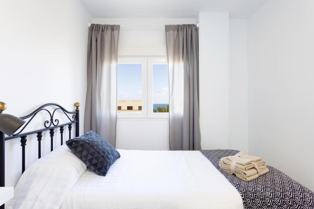 Postel nebo postele na pokoji v ubytování Home2Book Serene Apartment Ocean Breeze, Bajamar