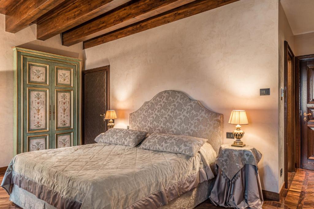Postel nebo postele na pokoji v ubytování Bar Vitelli Charming suites