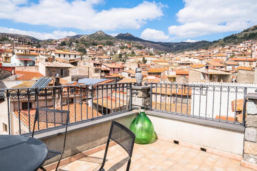 a balcony with a view of a city at Su Cucumiao - Tipica casa con terraza panoramica in Santu Lussurgiu