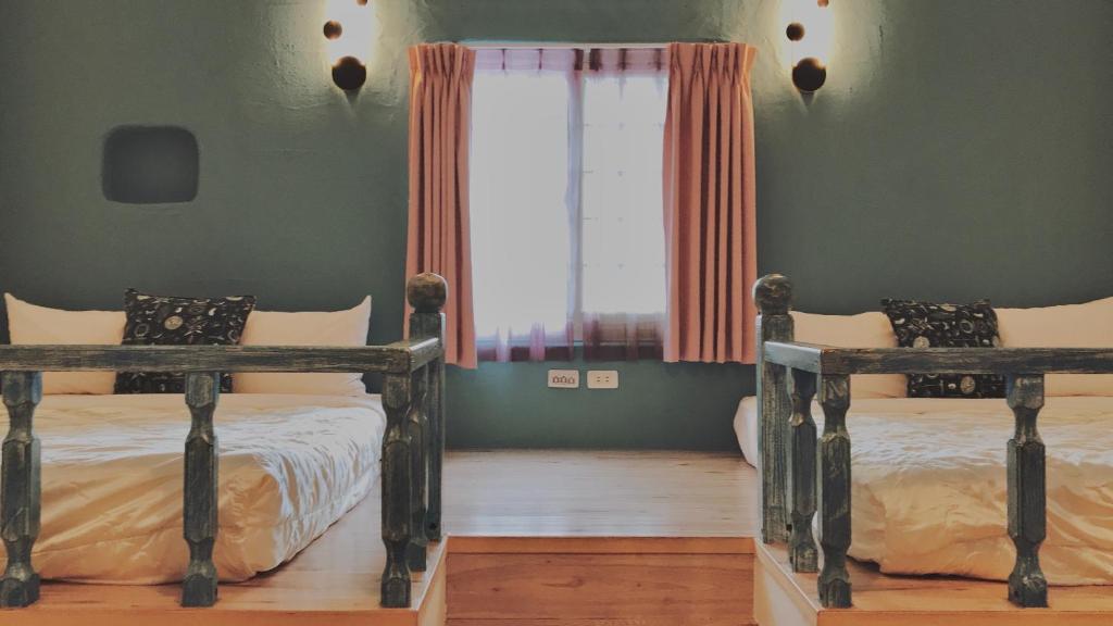 Rúm í herbergi á Bethlehem B&B Kenting