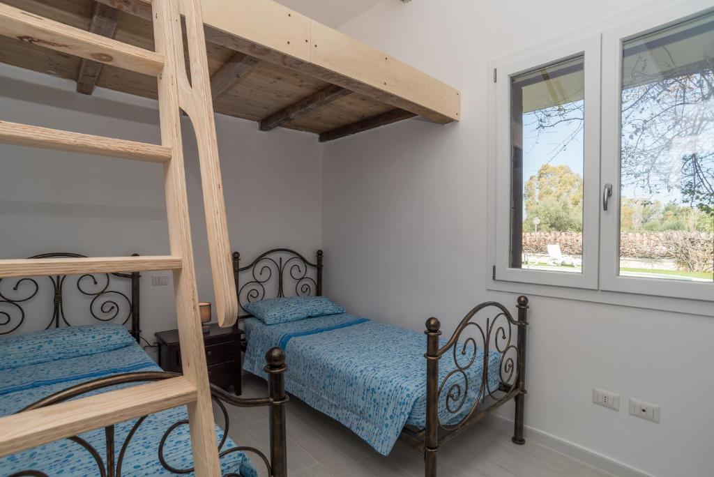 A bed or beds in a room at Villa Marisa