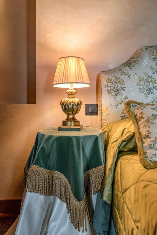 Postel nebo postele na pokoji v ubytování Bar Vitelli Charming suites