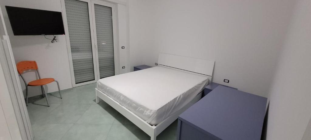 Postel nebo postele na pokoji v ubytování Scauri Inn