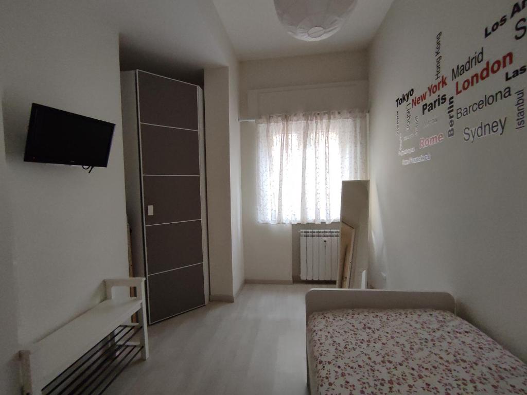 A bed or beds in a room at LA CASA DEI NONNI