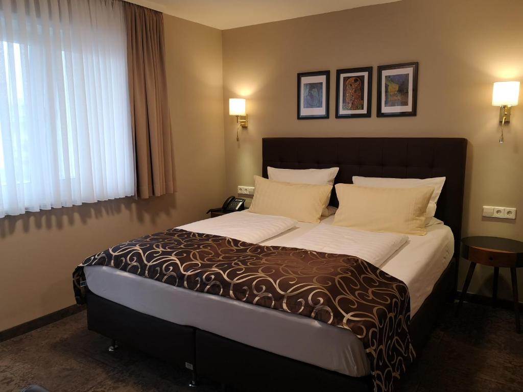 Postelja oz. postelje v sobi nastanitve Hotel Regina