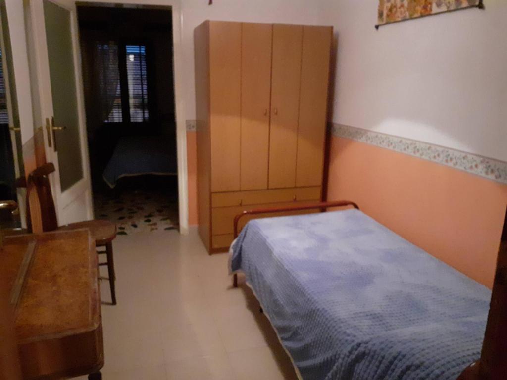 A bed or beds in a room at Affittacamere GERANI