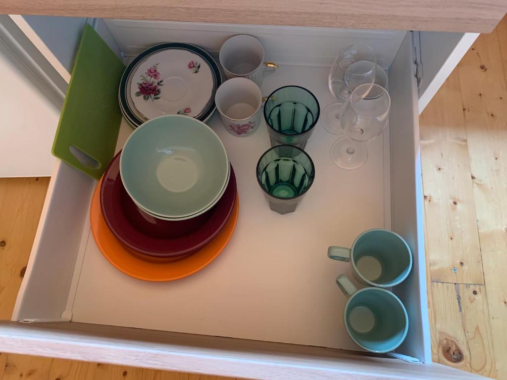 a box filled with bowls and plates and cups at LOFT Natalya Gold in Český Krumlov