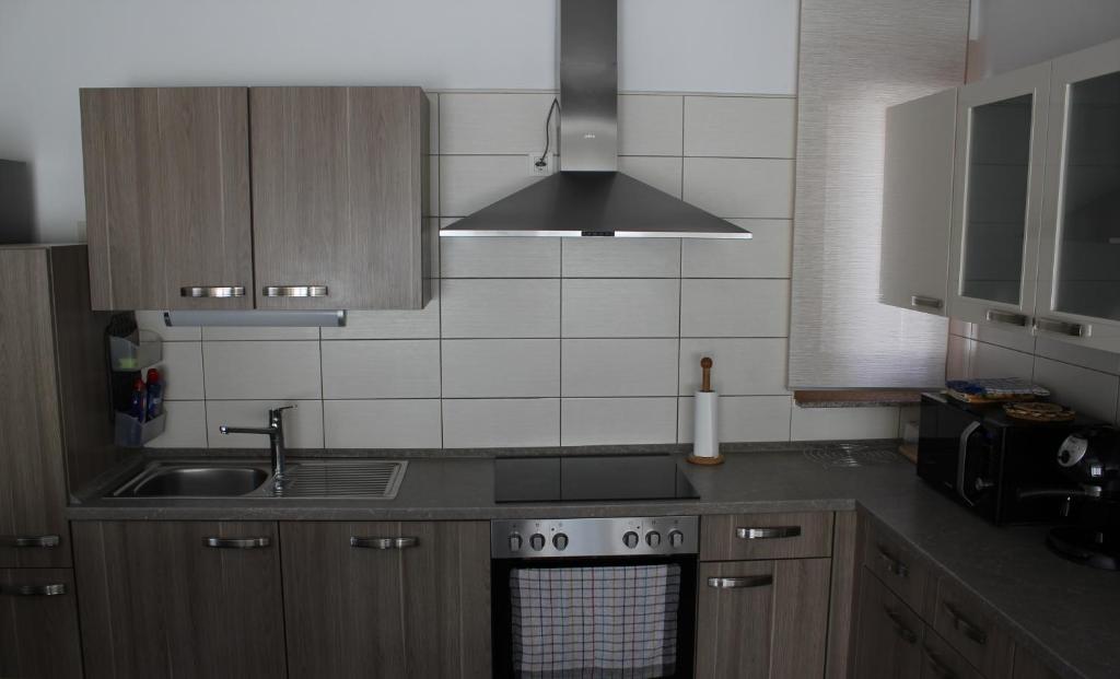 Kuchyň nebo kuchyňský kout v ubytování Apartma V&T