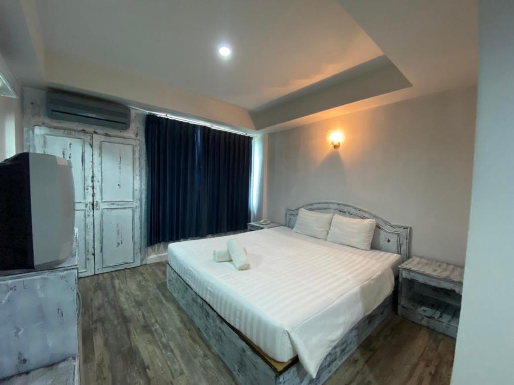 Postel nebo postele na pokoji v ubytování Sun Moon Hotel