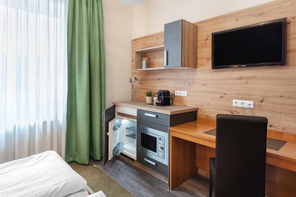 Kuchyň nebo kuchyňský kout v ubytování Schieners Hotel & Apfelhof Apartments