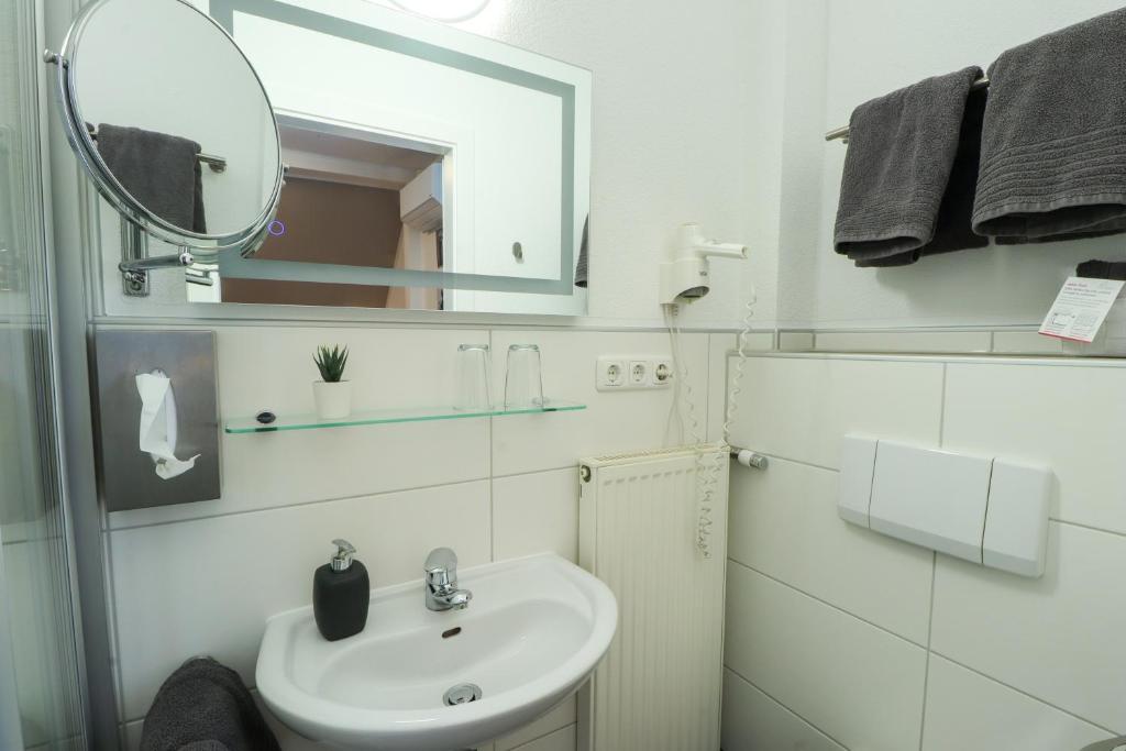 Koupelna v ubytování Hotel Am Dalwigker Tor