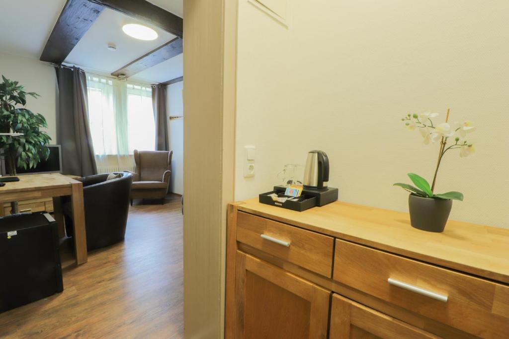 TV a/nebo společenská místnost v ubytování Hotel Am Dalwigker Tor