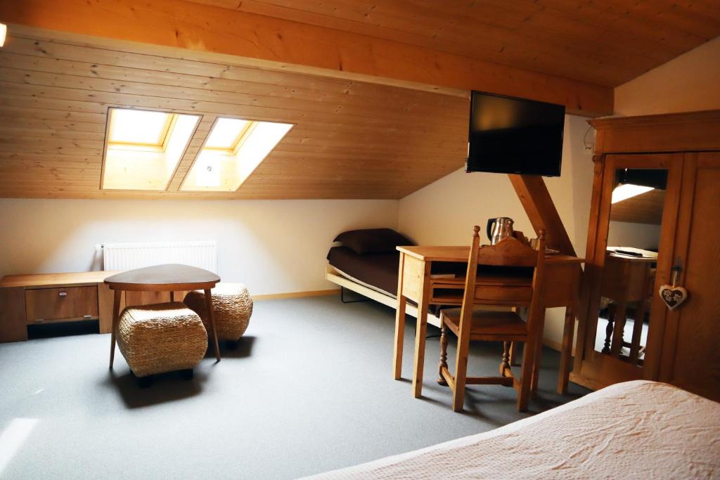 Ένα ή περισσότερα κρεβάτια σε δωμάτιο στο Gruyère Rooms