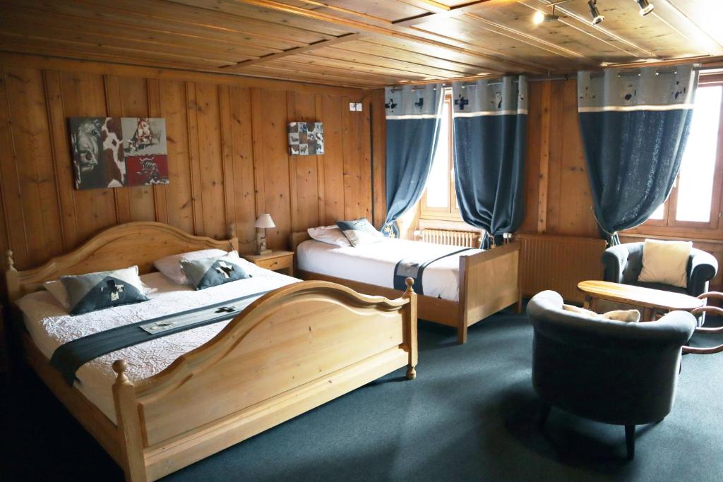Ένα ή περισσότερα κρεβάτια σε δωμάτιο στο Gruyère Rooms