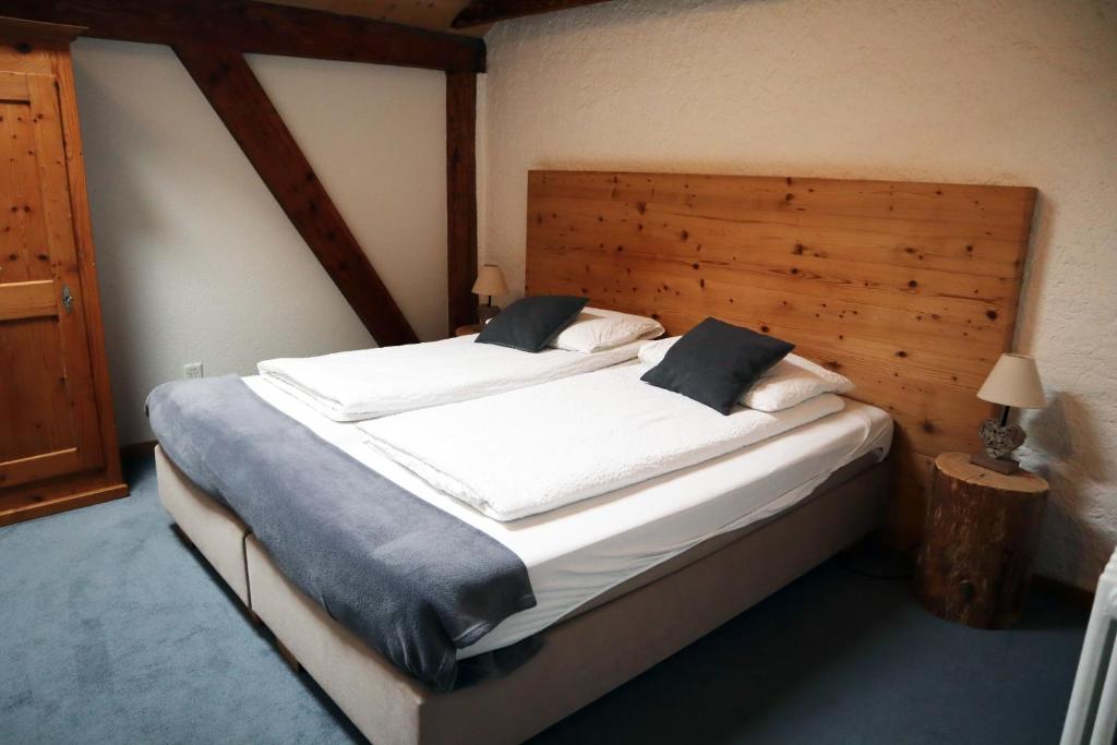 Ένα ή περισσότερα κρεβάτια σε δωμάτιο στο Gruyère Rooms