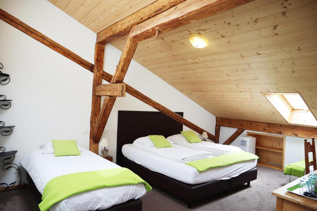 Ένα ή περισσότερα κρεβάτια σε δωμάτιο στο Gruyère Rooms