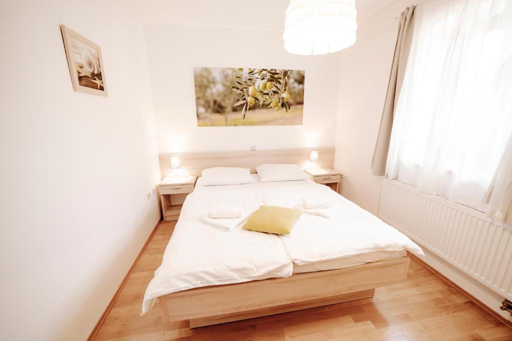 Łóżko lub łóżka w pokoju w obiekcie Villa Begonia