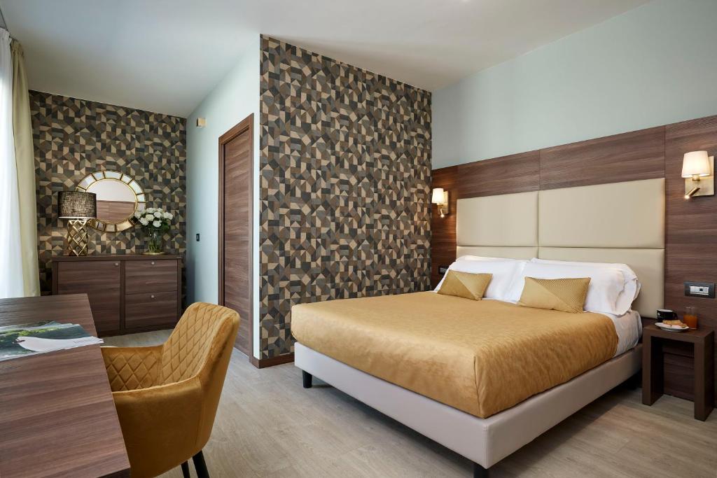 Postel nebo postele na pokoji v ubytování Hotel Spigamonti