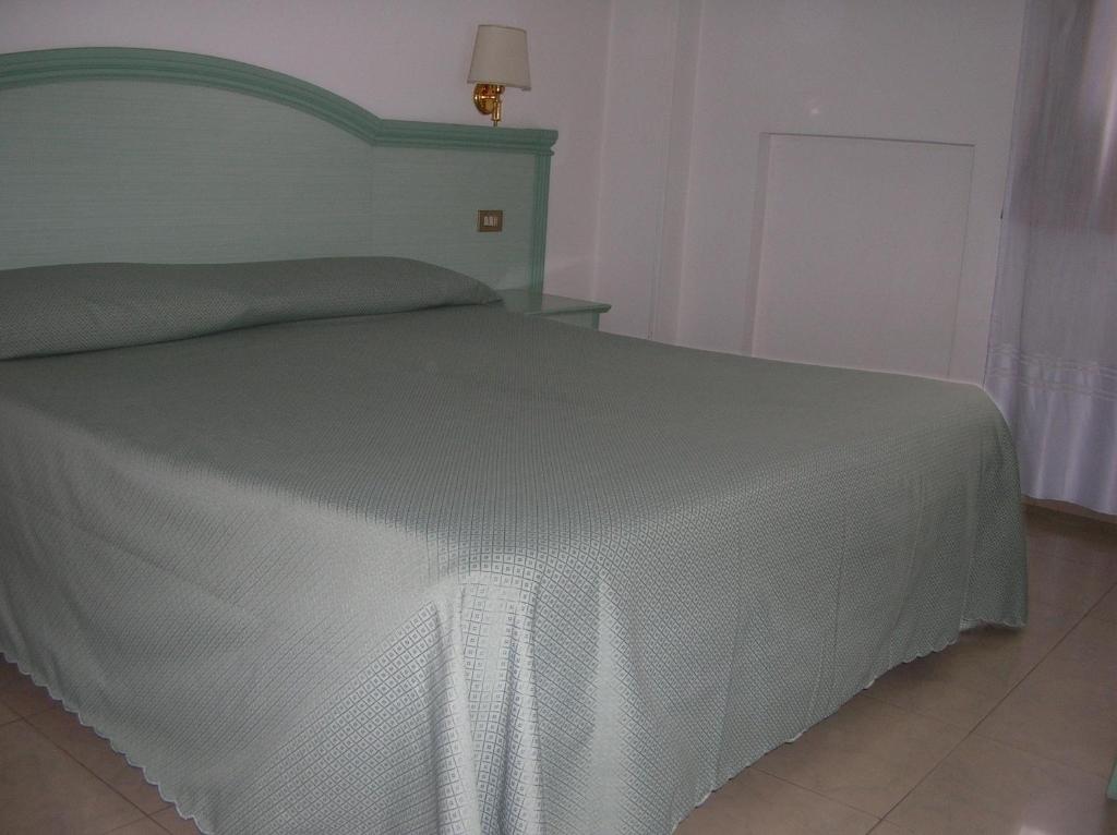 Uma cama ou camas num quarto em Chiara Stella Guest House