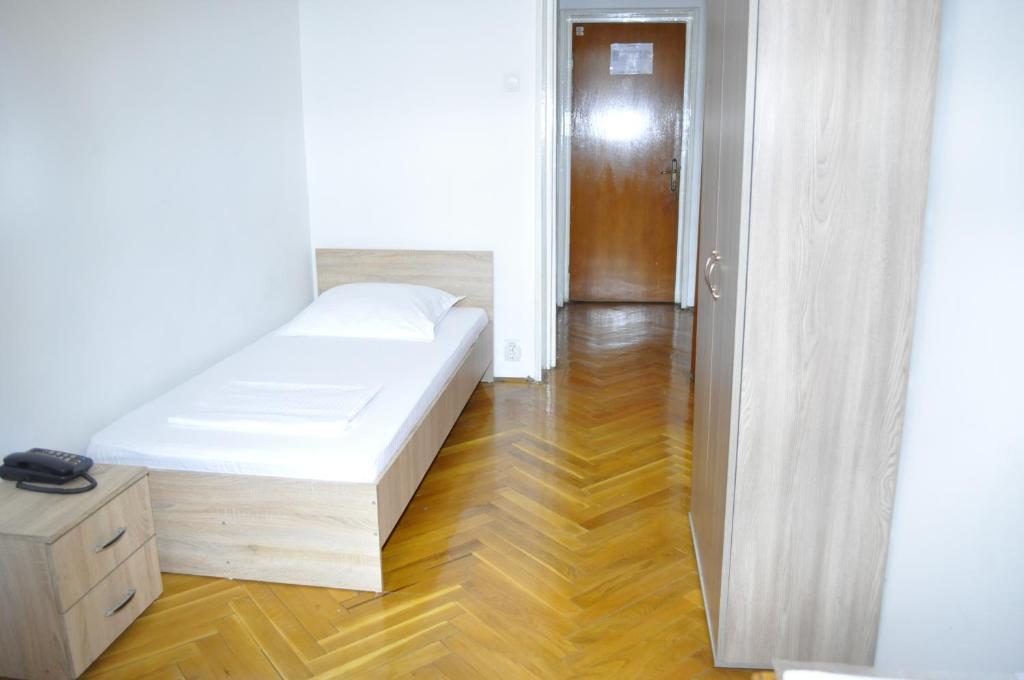 Postel nebo postele na pokoji v ubytování Hotel Triumf