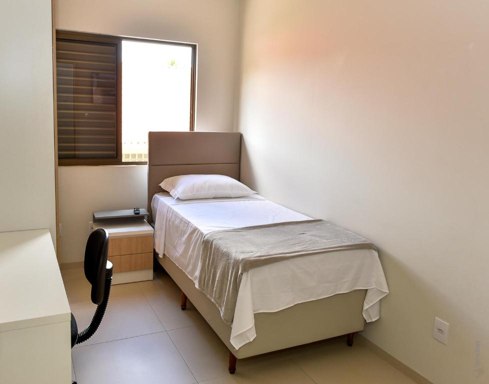 Postel nebo postele na pokoji v ubytování Hotel Plaza Garden