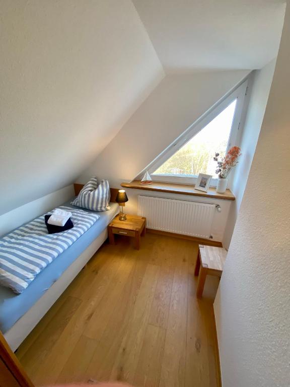 Postel nebo postele na pokoji v ubytování Ferienwohnung Uttied
