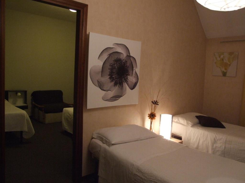 Postel nebo postele na pokoji v ubytování Hotel Orvieto