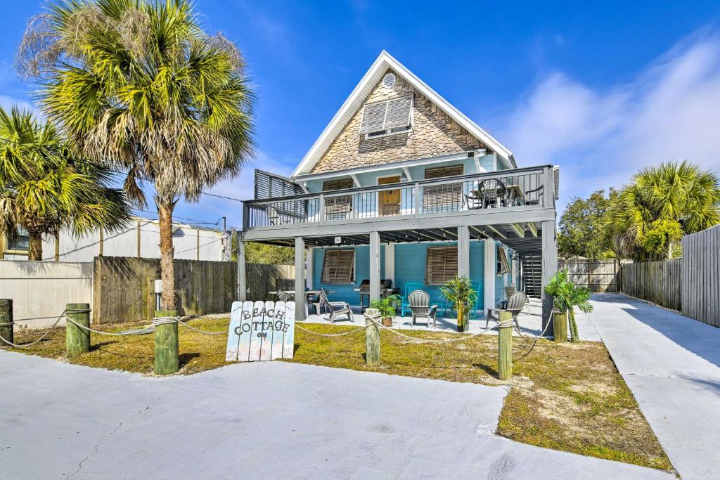 a house with a sign in front of it at PCB Group Retreat with Deck, 1 Block to Beach! in Panama City Beach
