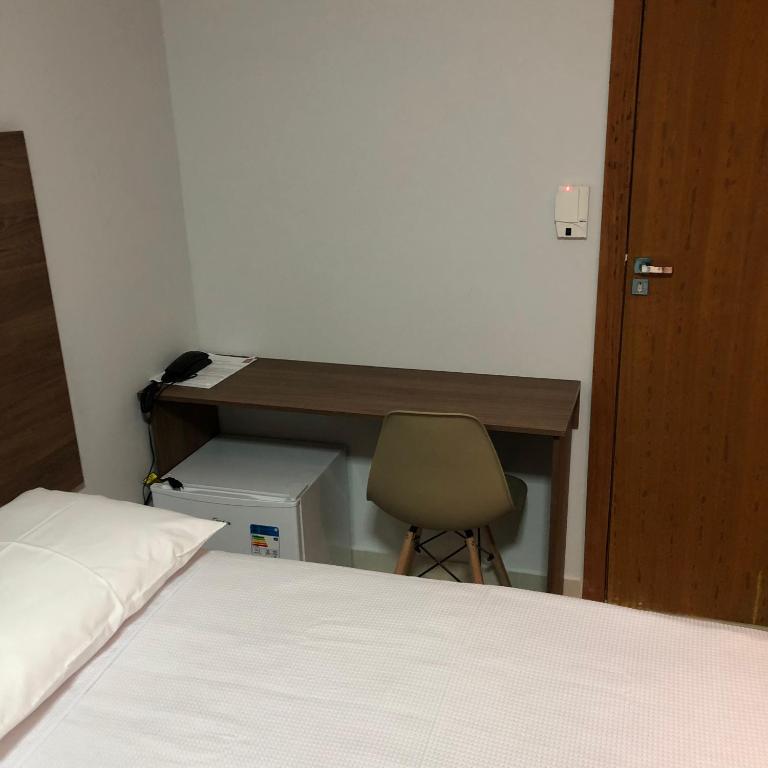 Postel nebo postele na pokoji v ubytování KK Palace Hotel