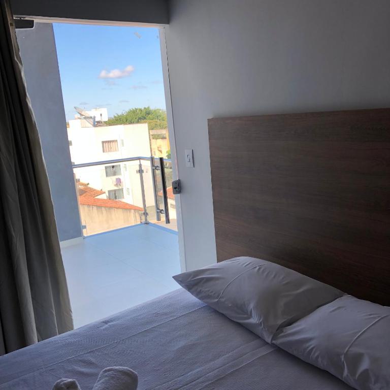 Postel nebo postele na pokoji v ubytování KK Palace Hotel