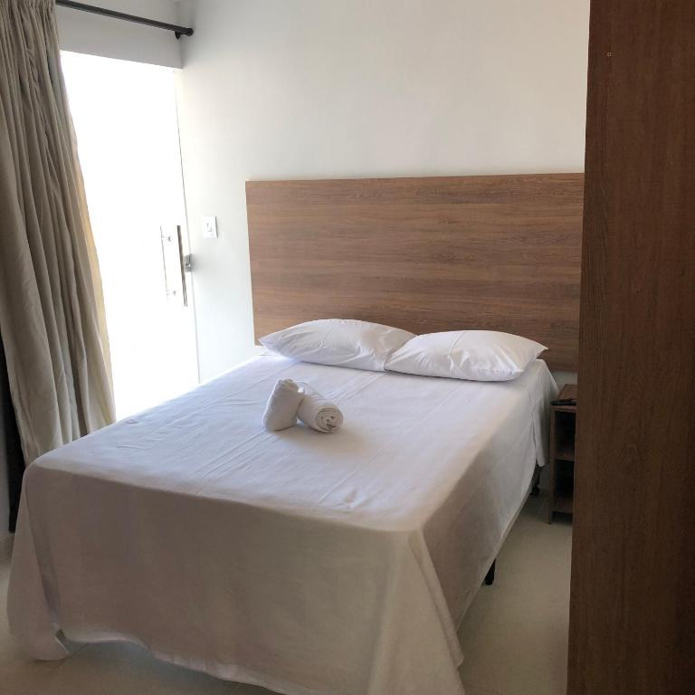 Postel nebo postele na pokoji v ubytování KK Palace Hotel