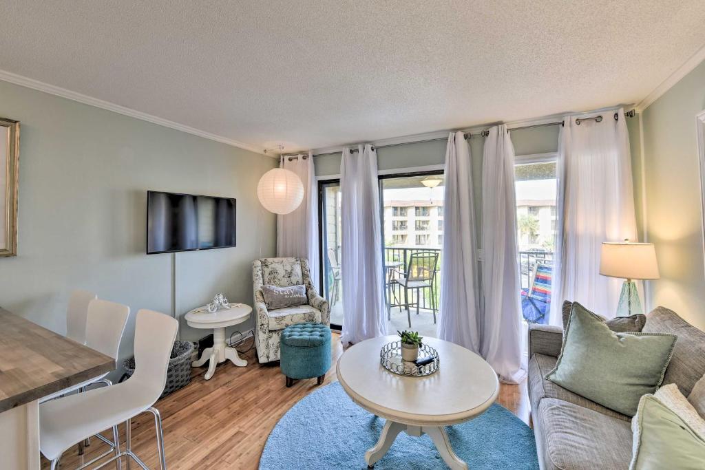 a living room with a couch and a table at Beach and Pool Access Hilton Head Family Escape! in Hilton Head Island