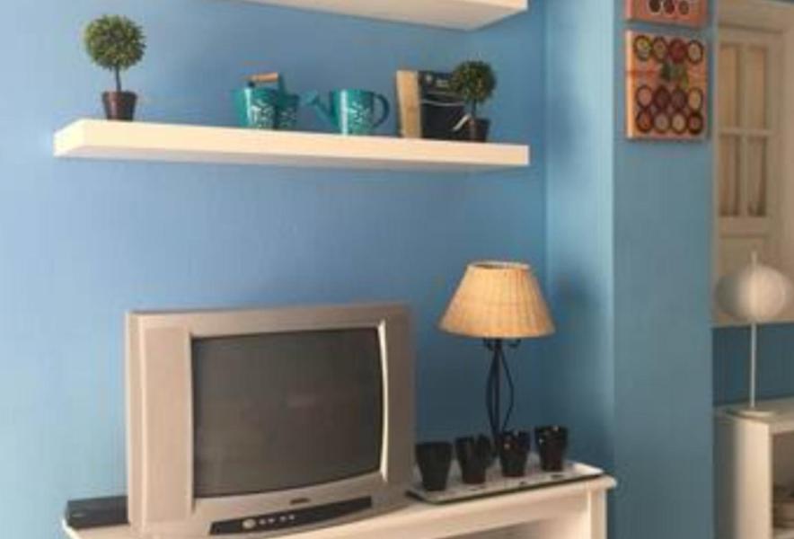 A television and/or entertainment centre at Islantilla a 50 metros de la playa