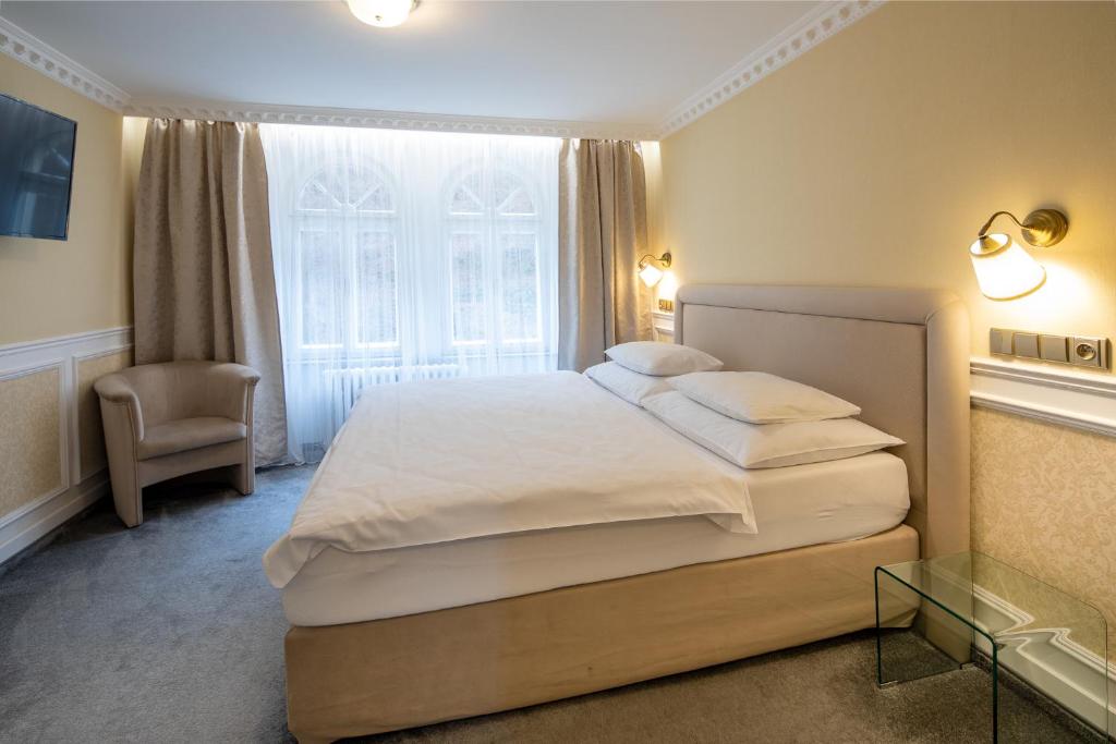 Łóżko lub łóżka w pokoju w obiekcie Villa Basileia Riverside