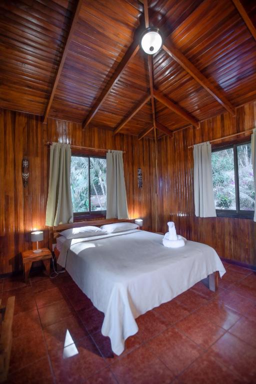 Postel nebo postele na pokoji v ubytování Hotel El Jardin
