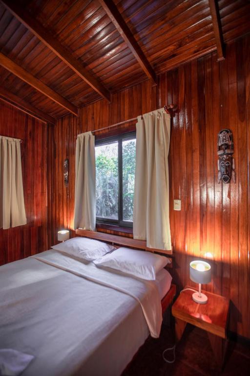 Postel nebo postele na pokoji v ubytování Hotel El Jardin
