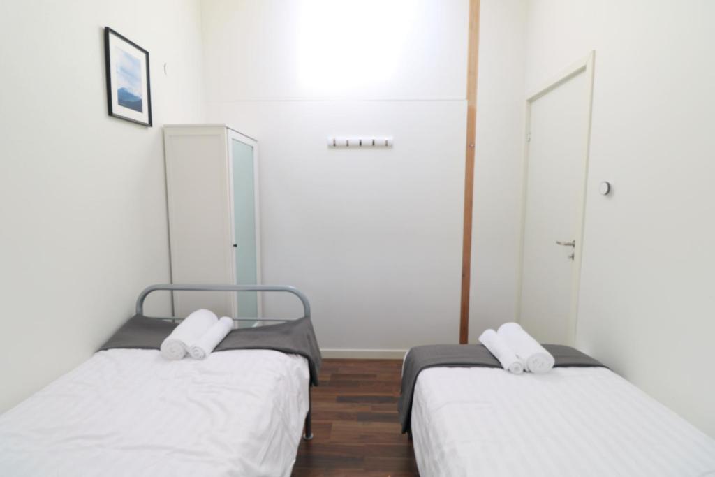 Postel nebo postele na pokoji v ubytování Kinna Central Town Villa