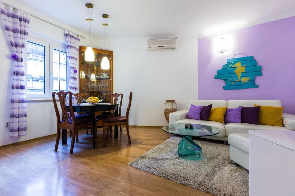 a living room with a couch and a table at Apartment Anna in Zadar