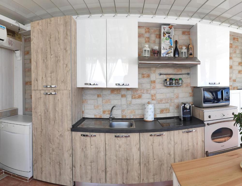 Kuchyňa alebo kuchynka v ubytovaní Casa Marianna Short Lets