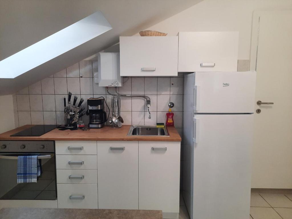 Kuchyňa alebo kuchynka v ubytovaní Apartments LUNA